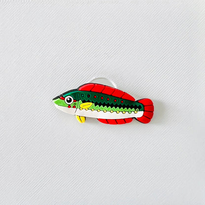Vibrant multicolour fish charm with green, red, and yellow accents, perfect for adding fun to your footwear.
