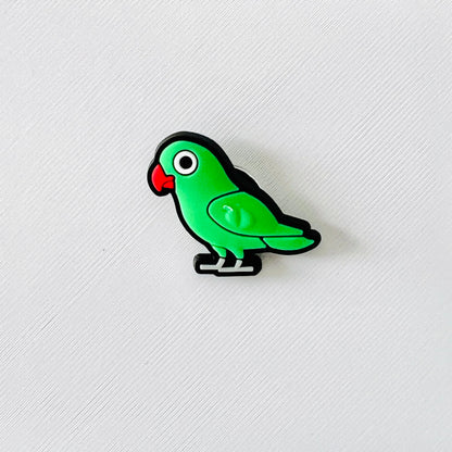 Bright green love bird charm with a playful design, featuring a red beak and large eye, perfect for shoe accessories.