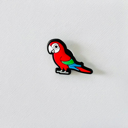 Vibrant red and green macaw charm with a playful design, perfect for adding a tropical touch to your shoes.