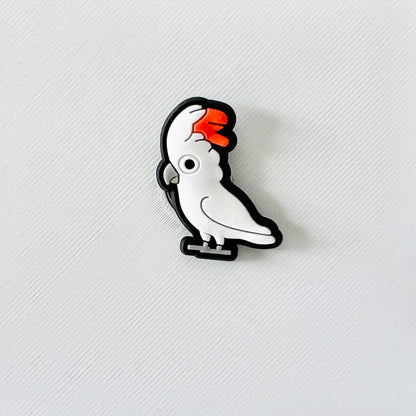 Charming white cockatoo with soft feathers and an orange beak, perfect for adding flair to your footwear.