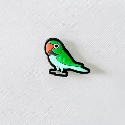 Bright green parrot charm with an orange beak, perfect for adding a tropical touch to your shoes.