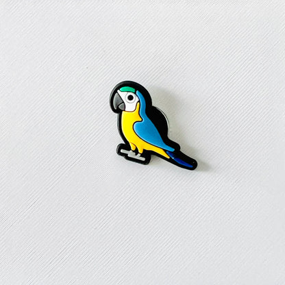 Colorful macaw parrot charm featuring bright yellow and blue hues, perfect for adding a tropical touch to footwear.