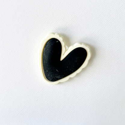 Large black and white heart charm with a scalloped edge, perfect for adding a stylish touch to your shoes.