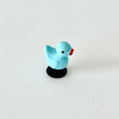 Vibrant blue duck charm with a cheerful expression, perfect for adding fun to shoes and accessories.