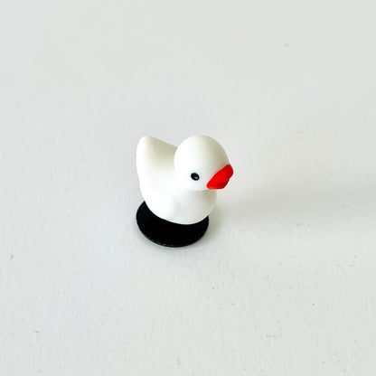 Adorable white duck charm with a cheerful expression, perfect for adding fun to your shoes!