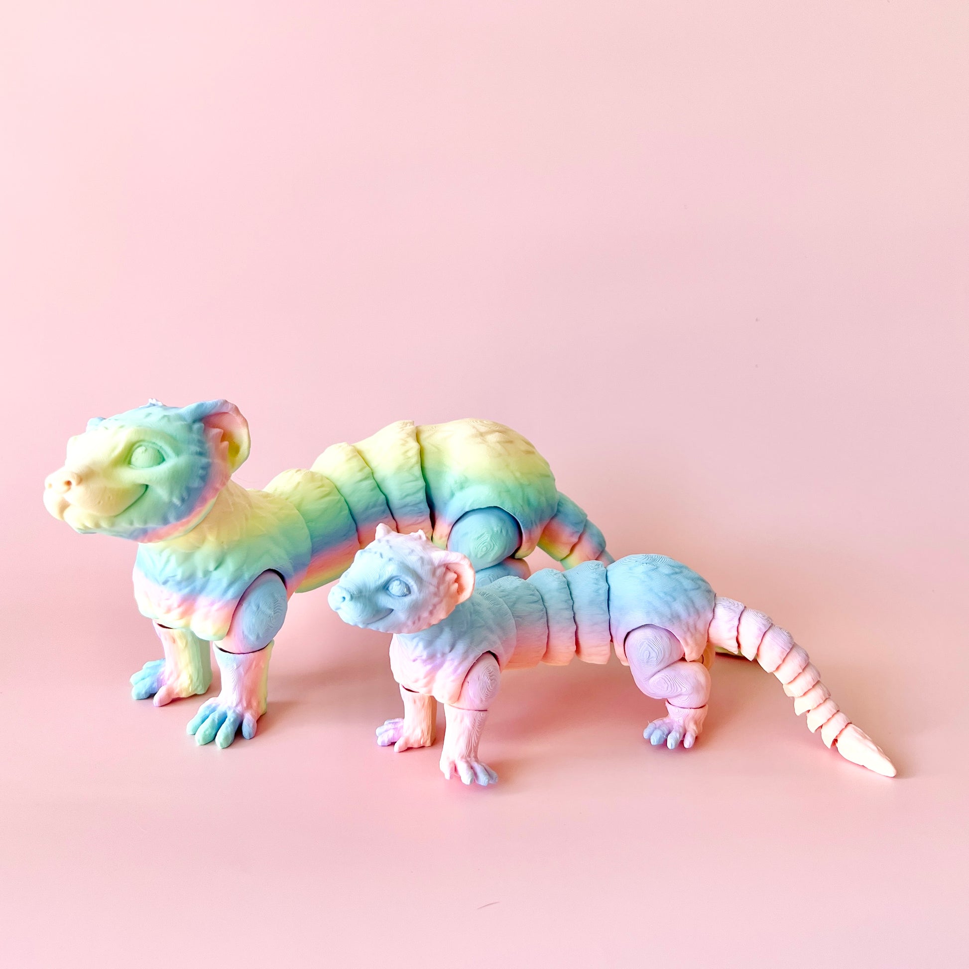 A vibrant, articulated ferret figurine in playful pastel colors, showcasing intricate details and charm. Perfect for collecto
