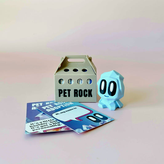 A pastel blue character with big eyes next to a cream-colored carrier and colorful adoption cards on a soft background.