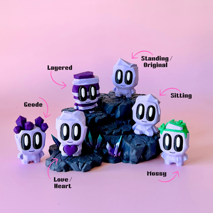 Colorful characters with large eyes on dark rocky terrain, surrounded by vibrant crystals against a soft pink backdrop.