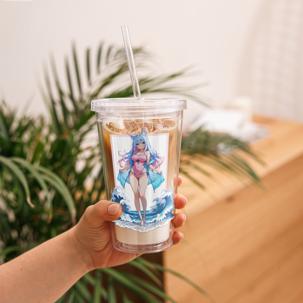 Clear tumbler featuring Aqua Fox artwork, whimsical and colorful, held against a backdrop of lush greenery.