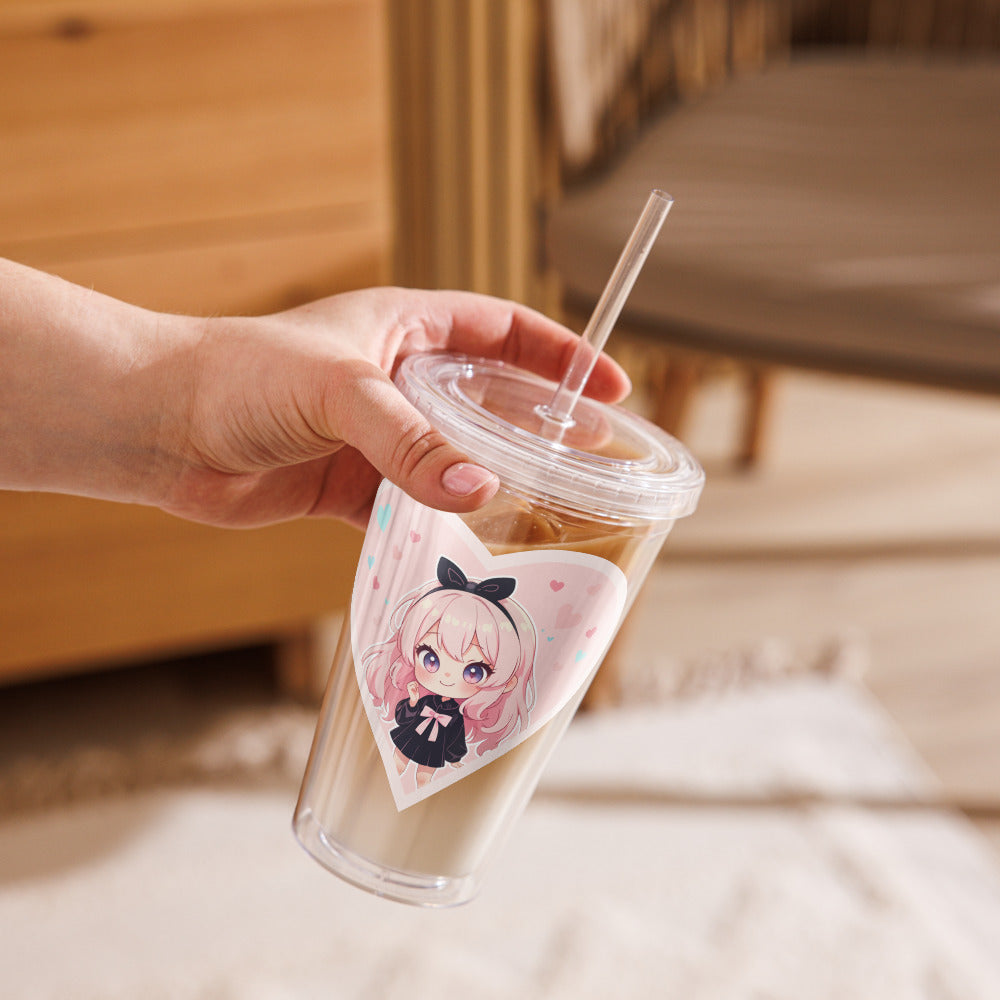 A hand holds a clear tumbler featuring a cute chibi character in a pink heart, perfect for Valentine's Day.