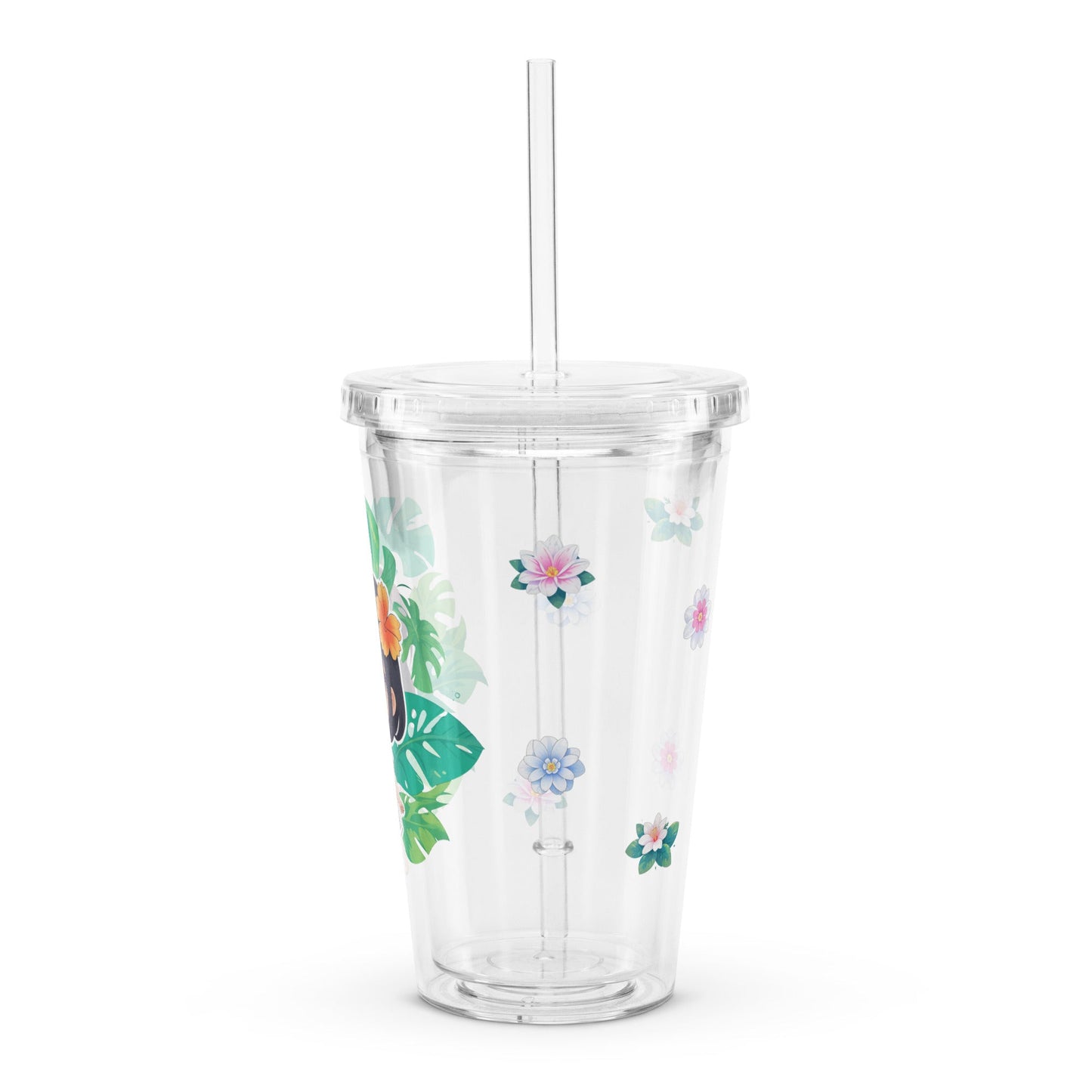 Clear tumbler featuring vibrant tropical leaves and flowers, perfect for enjoying refreshing drinks in style.