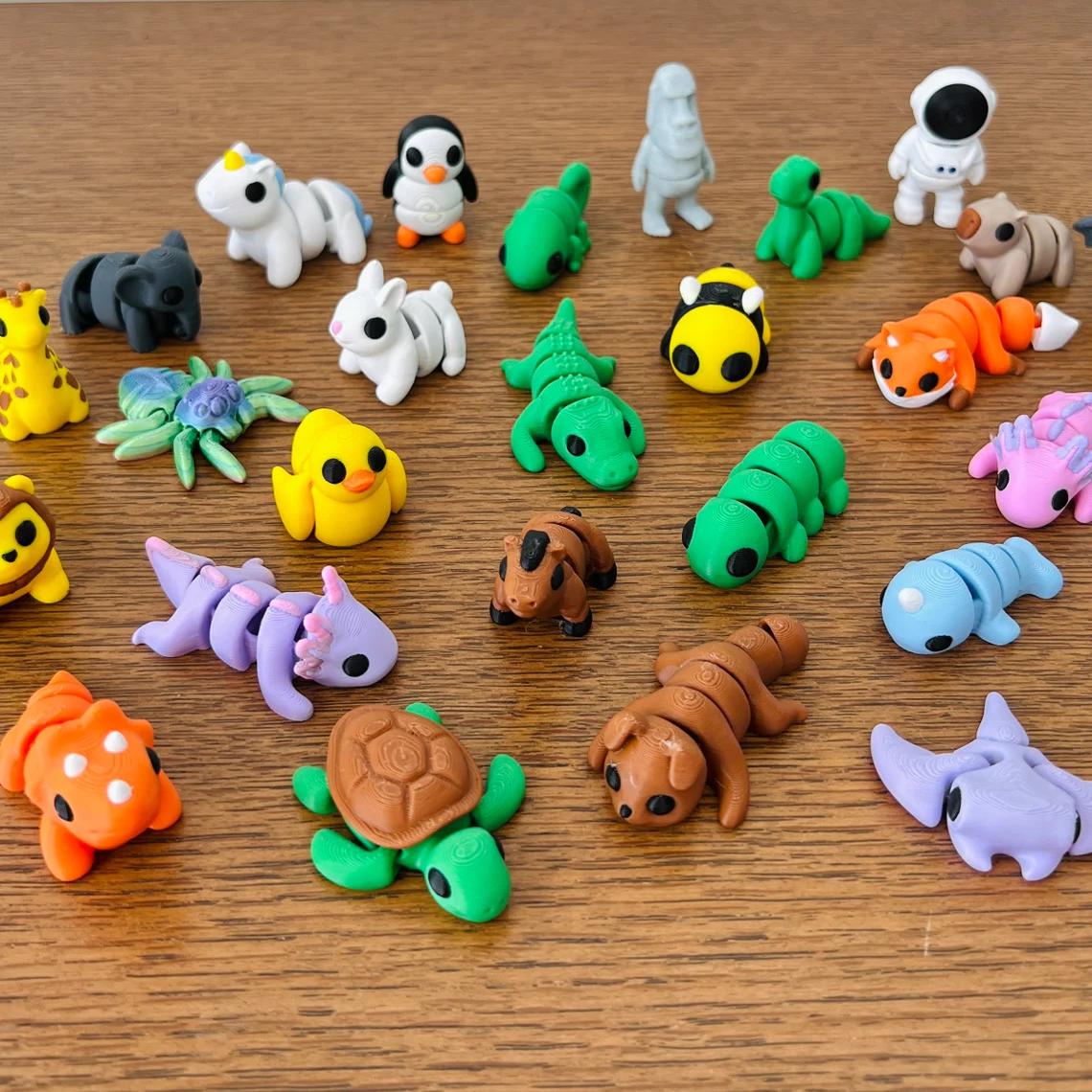 Colorful, articulated mini figures in various animal and food shapes, arranged playfully on a wooden surface.