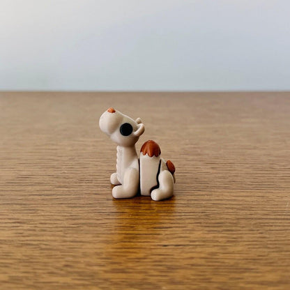 A cute, articulated mini camel with brown accents, perfect for sensory play or as a charming collectible.