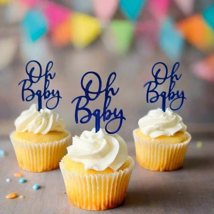 Playful "Oh Baby" toppers in navy atop frosted yellow cupcakes, set against a colorful, festive backdrop. Perfect for baby sh