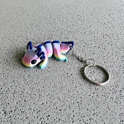 Vibrant rainbow axolotl keychain with colorful body and playful features, perfect for adding flair to bags or keys.
