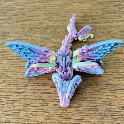 Delicate Butterfly Dragon Tadling with intricate, colorful wings, blending whimsical charm and mythical allure.