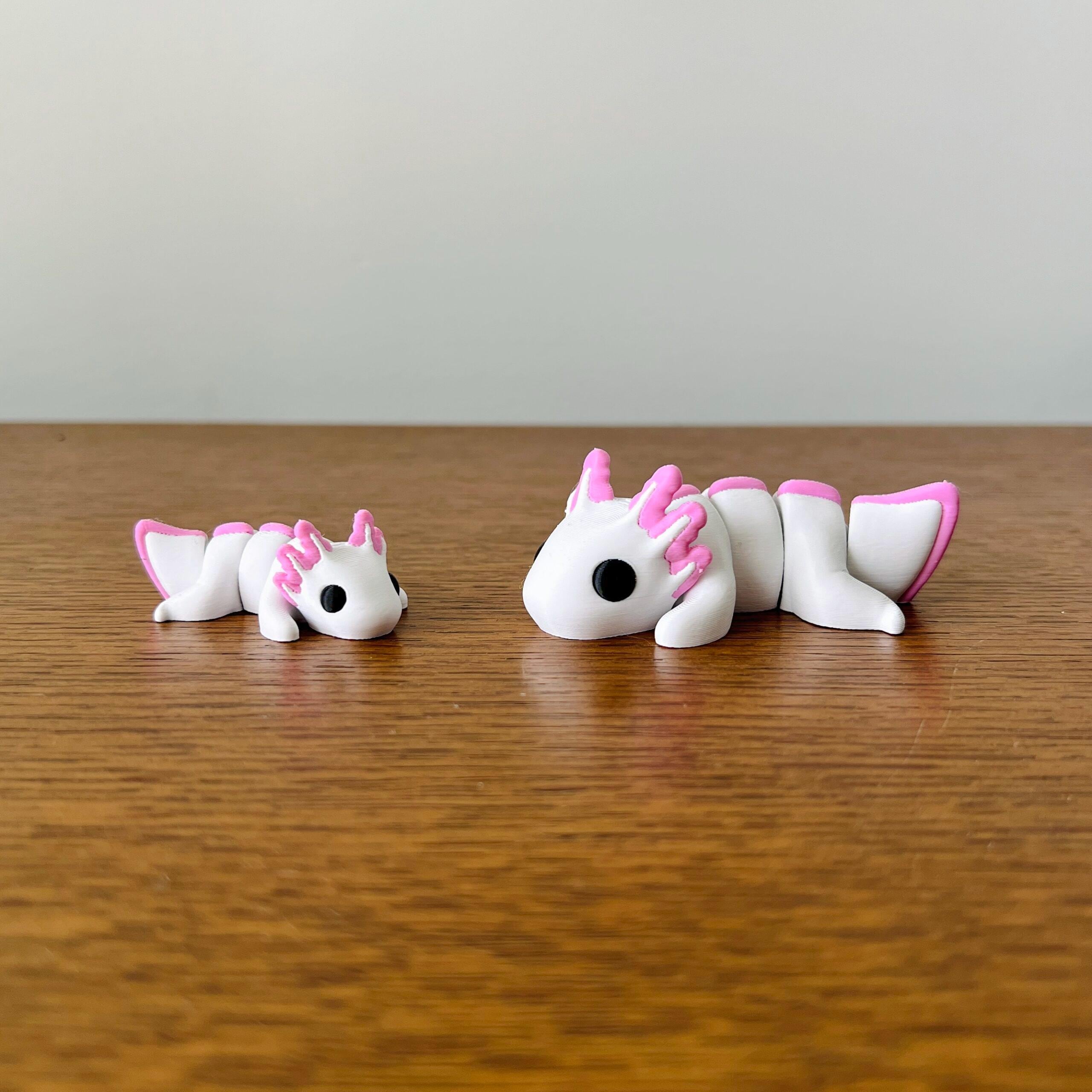 Charming white and pink Axolotls, perfect for sensory play, stress relief, or as delightful collectibles.