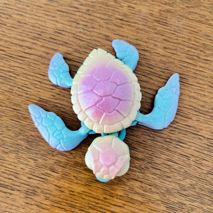 Colorful 3D-printed sea turtle figurine with intricate details, showcasing a blend of pastel hues and a charming pose.