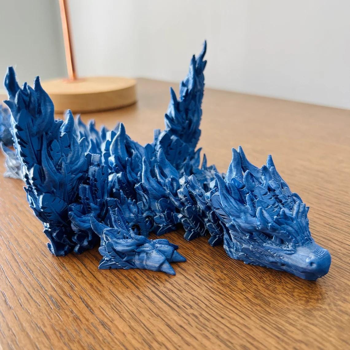 A majestic blue Phoenix Dragon with intricate detailing, showcasing powerful wings and a striking presence.