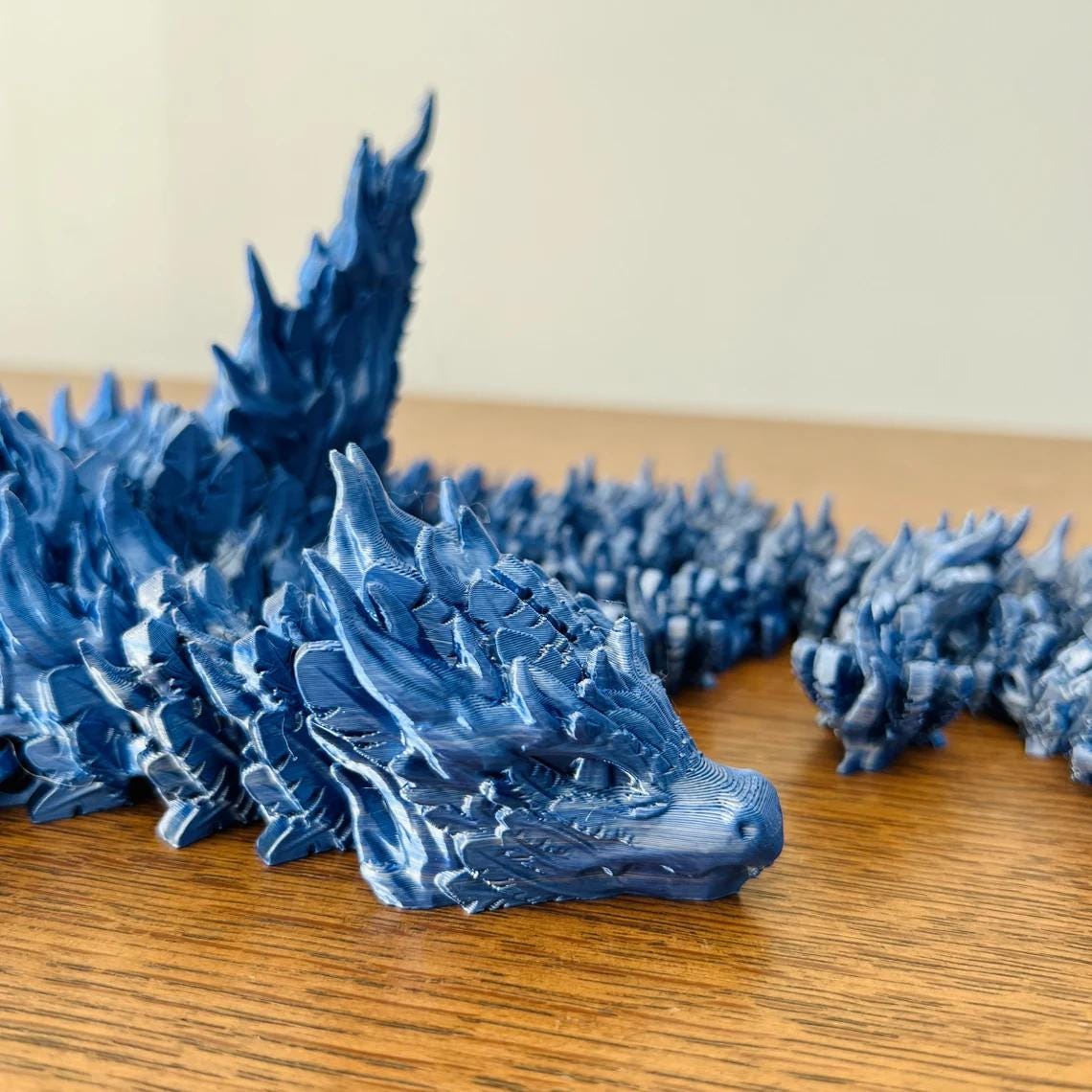Majestic blue Phoenix Dragon with intricate detailing, powerful wings, and a captivating design, perfect for fantasy lovers.