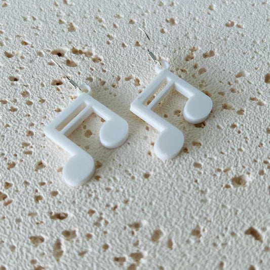 White music note dangle earrings with 925 sterling silver hooks, showcasing an elegant, lightweight design.