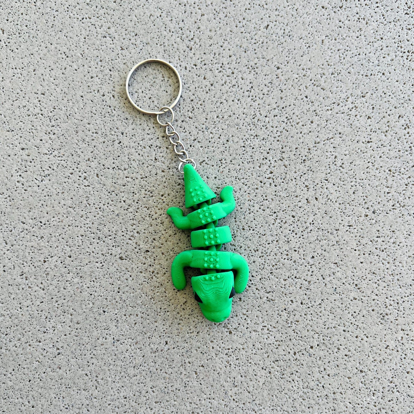 Bright green crocodile keychain featuring playful details, perfect for adding flair to keys or bags. Ideal for gifting!