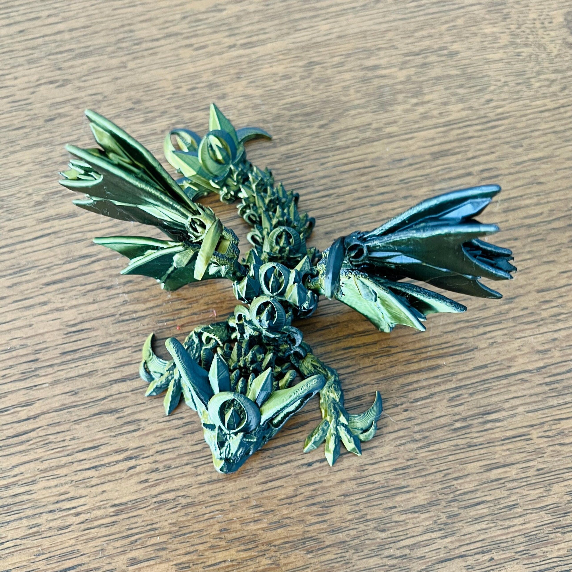 A sleek, dark dragon with bat-like wings and intricate details, evoking the allure of night and mystery.