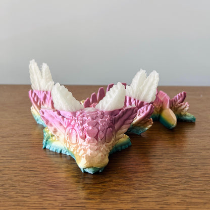 A whimsical dragon with colorful scales and elegant wings, blending axolotl charm with playful details.
