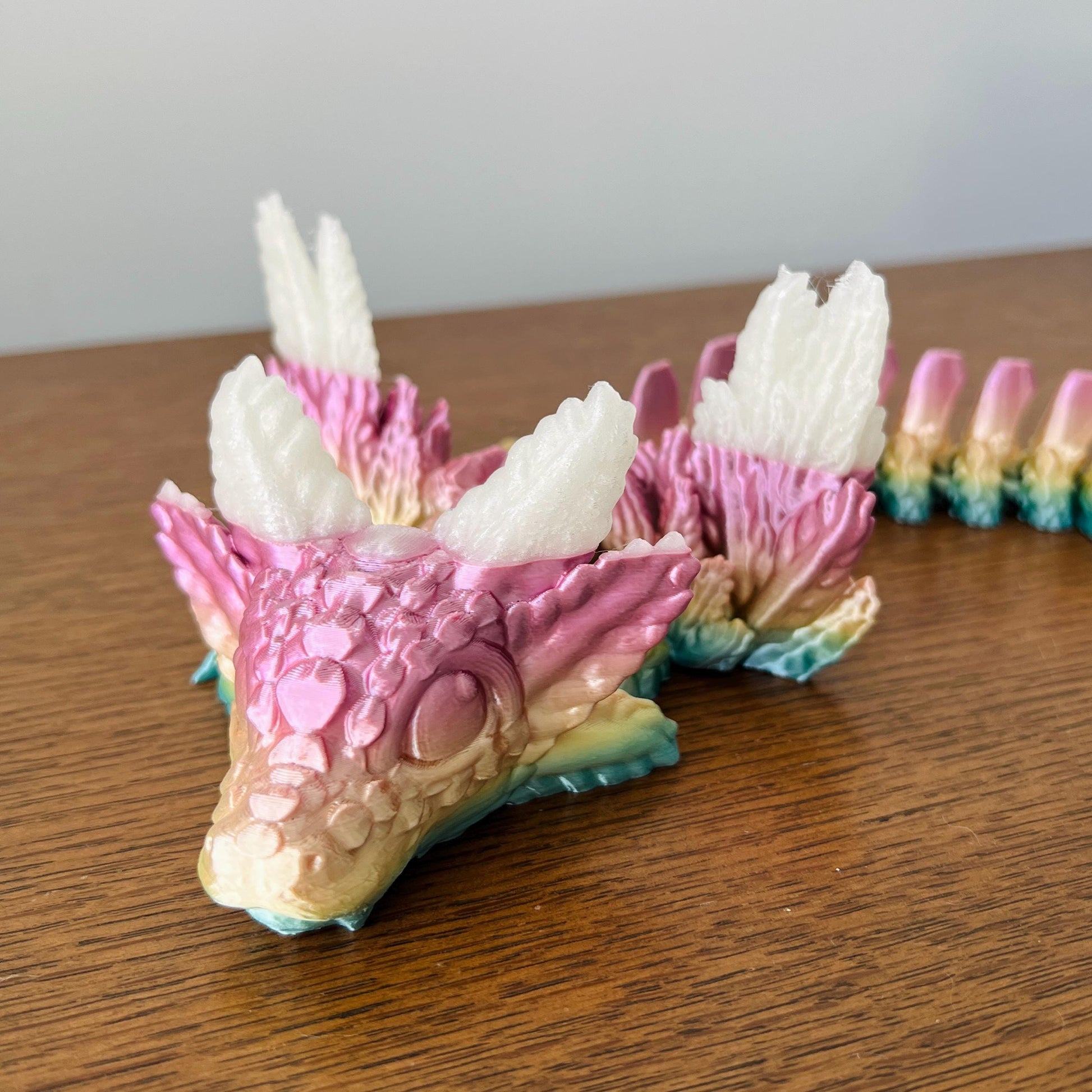 Whimsical Axolotl Winged Dragon with pastel colors, intricate scales, and elegant wings, exuding playful charm.
